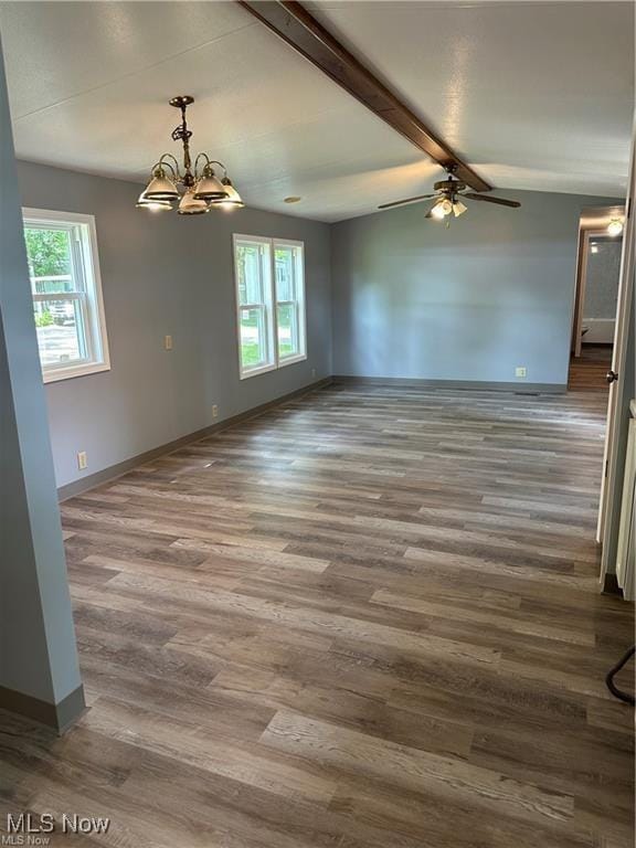 7443 Spillway Rd Unit 63, Lisbon, OH 44432 - empty room with healthy amount of natural light, a chandelier, ceiling fan, and wood finished floors