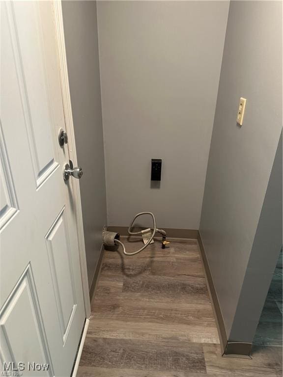 7443 Spillway Rd Unit 63, Lisbon, OH 44432 - laundry room with wood finished floors and baseboards