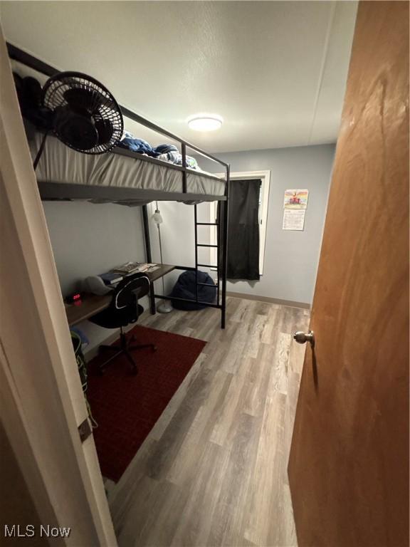 7443 Spillway Rd Unit 63, Lisbon, OH 44432 - bedroom with wood finished floors