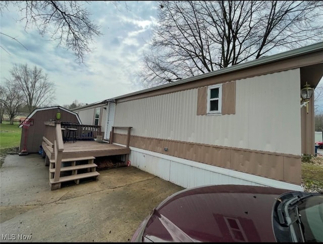 7443 Spillway Rd Unit 63, Lisbon, OH 44432 - view of side of home featuring a deck