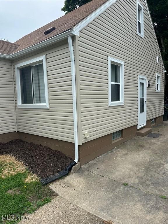 1042 Frederick Blvd, Akron, OH 44320 - view of side of property featuring roof with shingles