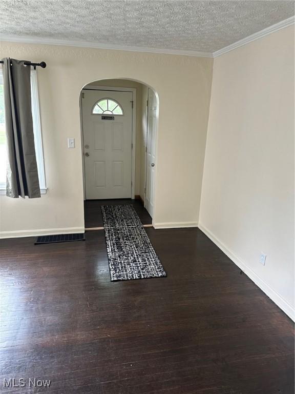 1042 Frederick Blvd, Akron, OH 44320 - foyer entrance with arched walkways, a textured ceiling, wood finished floors, and crown molding
