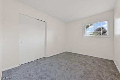6265 Thunderbird Dr, Mentor, OH 44060 - unfurnished bedroom featuring carpet flooring and a closet