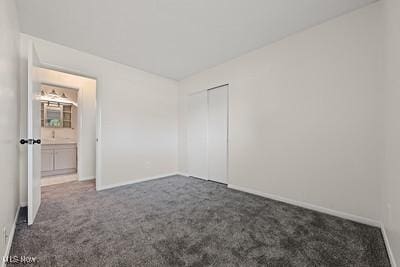 6265 Thunderbird Dr, Mentor, OH 44060 - unfurnished bedroom with dark carpet and a closet