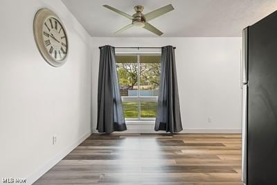 6265 Thunderbird Dr, Mentor, OH 44060 - empty room featuring a ceiling fan, plenty of natural light, and wood finished floors