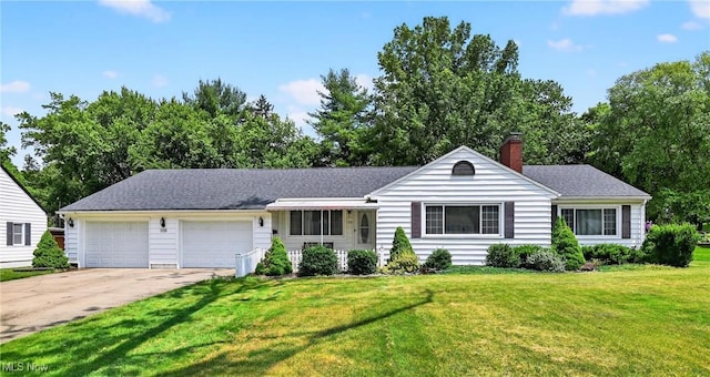 120 N Middle St, Columbiana, OH 44408 - ranch-style home featuring a garage, concrete driveway, a front yard, a chimney, and roof with shingles