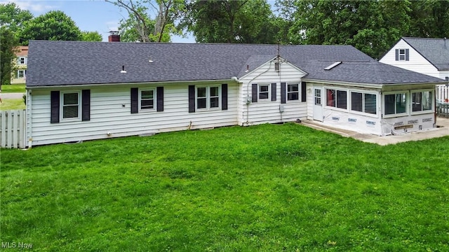 120 N Middle St, Columbiana, OH 44408 - rear view of house with a chimney, a shingled roof, and a sunroom