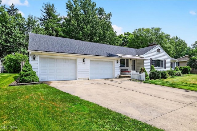 120 N Middle St, Columbiana, OH 44408 - single story home featuring driveway, a front lawn, a garage, a porch, and a shingled roof