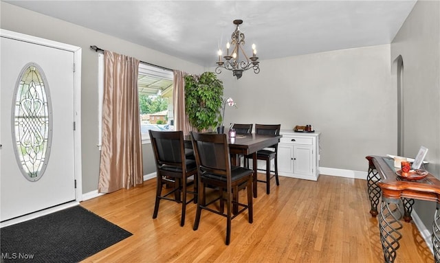 120 N Middle St, Columbiana, OH 44408 - dining room with a chandelier, light wood finished floors, and arched walkways