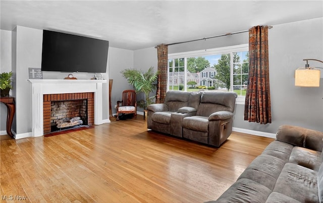 120 N Middle St, Columbiana, OH 44408 - living room featuring light wood finished floors and a fireplace