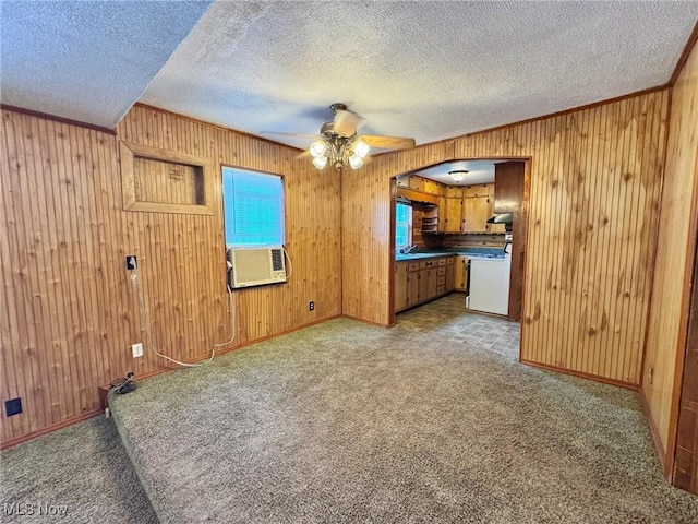 33 Knight Ln, Big Bend, WV 26136 - unfurnished living room with a textured ceiling, ceiling fan, wood walls, carpet flooring, and cooling unit