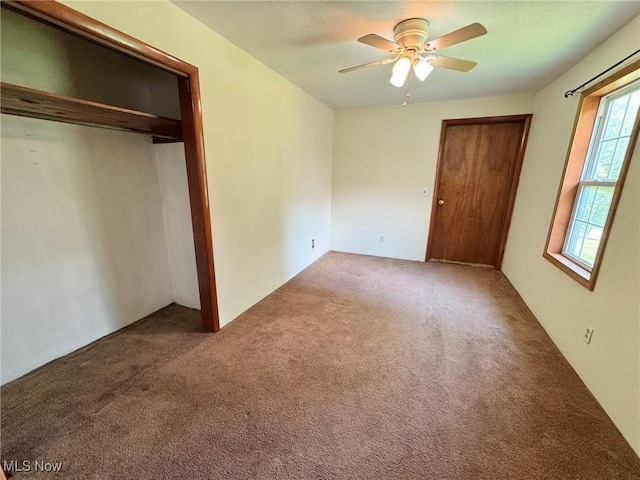 33 Knight Ln, Big Bend, WV 26136 - unfurnished bedroom featuring a closet, carpet, and a ceiling fan