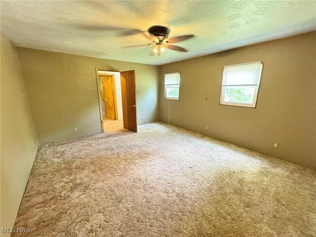 33 Knight Ln, Big Bend, WV 26136 - unfurnished bedroom with carpet flooring, a textured ceiling, and a ceiling fan