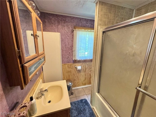 33 Knight Ln, Big Bend, WV 26136 - bathroom with ornamental molding, vanity, wainscoting, enclosed tub / shower combo, and tile patterned floors