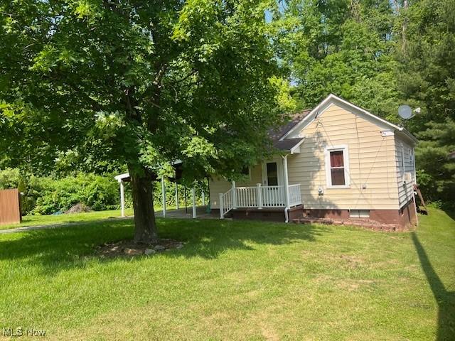 525 W 39th St, Shadyside, OH 43947 - back of house with crawl space, a yard, and covered porch