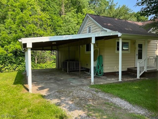 525 W 39th St, Shadyside, OH 43947 - view of parking / parking lot featuring dirt driveway and a carport