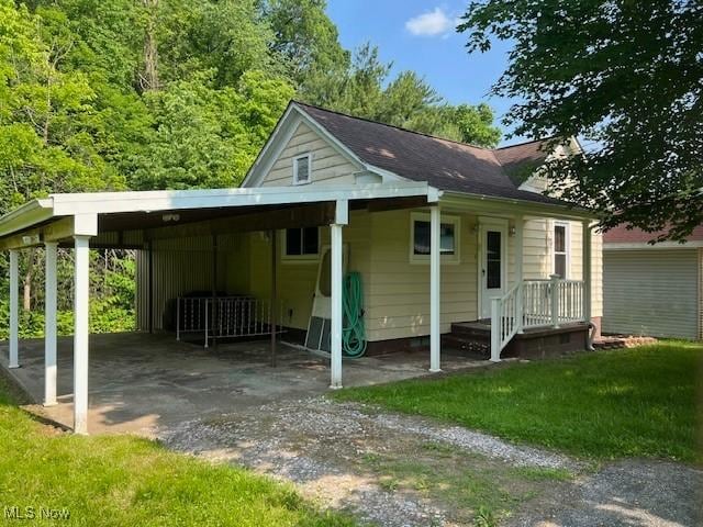 525 W 39th St, Shadyside, OH 43947 - exterior space featuring dirt driveway and a carport