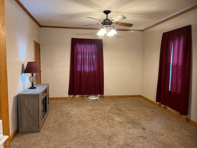 525 W 39th St, Shadyside, OH 43947 - foyer entrance with crown molding, light colored carpet, and ceiling fan
