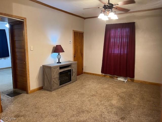 525 W 39th St, Shadyside, OH 43947 - unfurnished living room with light carpet, ceiling fan, and ornamental molding