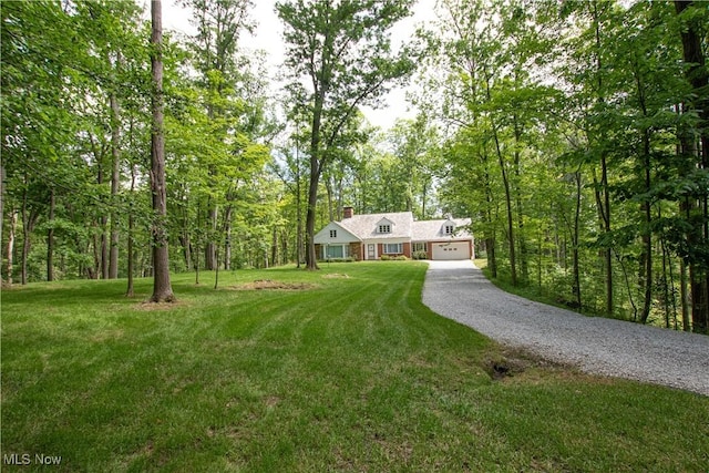 389 Bentleyville Rd, Moreland Hills, OH 44022 - view of front of house with gravel driveway, a garage, a front yard, a chimney, and a forest view