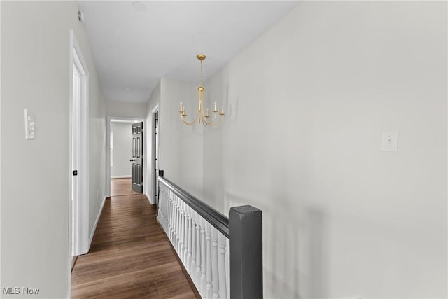 410 Elm St, Martins Ferry, OH 43935 - hall featuring dark wood finished floors and a chandelier