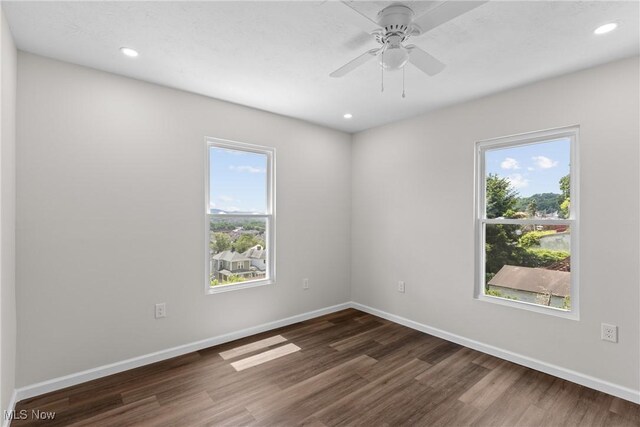 410 Elm St, Martins Ferry, OH 43935 - unfurnished room with dark wood-style floors, recessed lighting, and ceiling fan