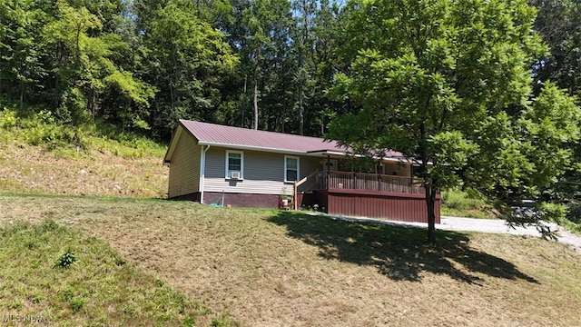 3028 Volcano Rd, Walker, WV 26180 - ranch-style house featuring a metal roof and a front lawn