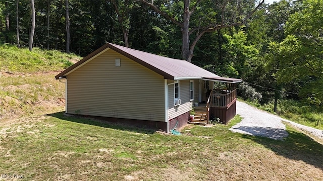 3028 Volcano Rd, Walker, WV 26180 - view of home's exterior with a yard, a metal roof, and a forest view