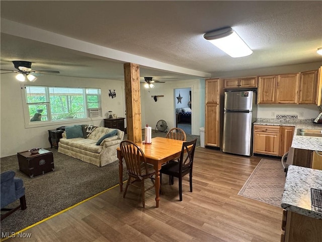 3028 Volcano Rd, Walker, WV 26180 - dining space with a ceiling fan, dark wood-style floors, and a textured ceiling