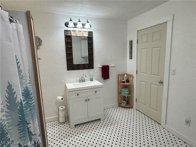 3028 Volcano Rd, Walker, WV 26180 - bathroom with vanity, a textured ceiling, a textured wall, and curtained shower