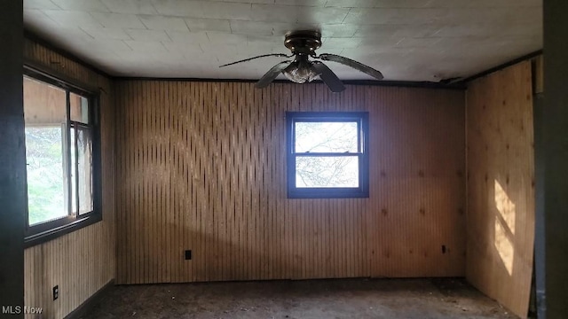 1332 Sunnyside St, East Liverpool, OH 43920 - spare room featuring healthy amount of natural light, a ceiling fan, and wood walls