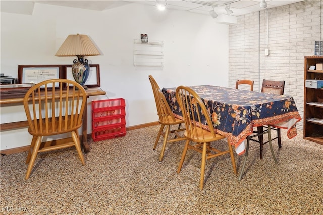 82 Pyle Rd, Oberlin, OH 44074 - dining space with rail lighting and brick wall