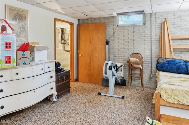 82 Pyle Rd, Oberlin, OH 44074 - bedroom featuring a drop ceiling and brick wall
