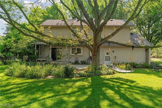 82 Pyle Rd, Oberlin, OH 44074 - back of house featuring a lawn and a patio area