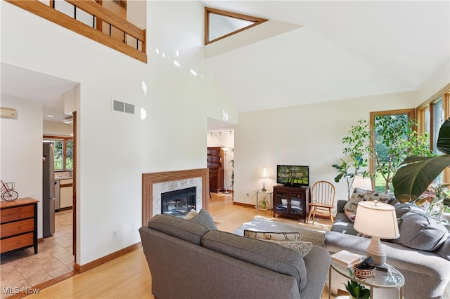 82 Pyle Rd, Oberlin, OH 44074 - living room featuring high vaulted ceiling, a high end fireplace, and light wood-style floors