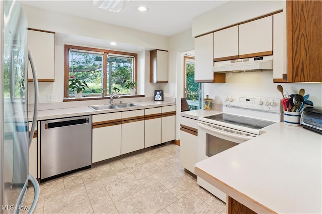 82 Pyle Rd, Oberlin, OH 44074 - kitchen featuring under cabinet range hood, appliances with stainless steel finishes, light countertops, white cabinetry, and recessed lighting