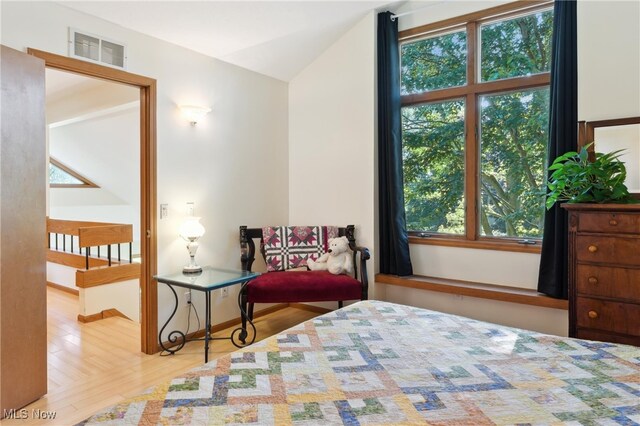 82 Pyle Rd, Oberlin, OH 44074 - bedroom with multiple windows, wood finished floors, and lofted ceiling