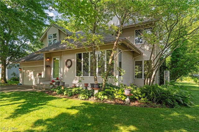 82 Pyle Rd, Oberlin, OH 44074 - view of front facade with an attached garage, a front yard, and driveway
