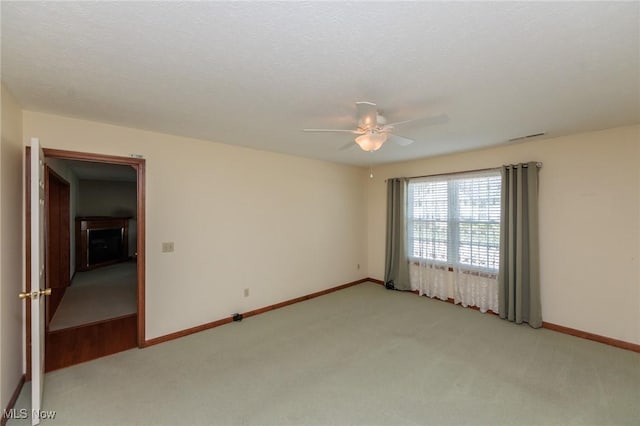 373 Chesapeake Cv, Painesville, OH 44077 - spare room with light colored carpet and a ceiling fan