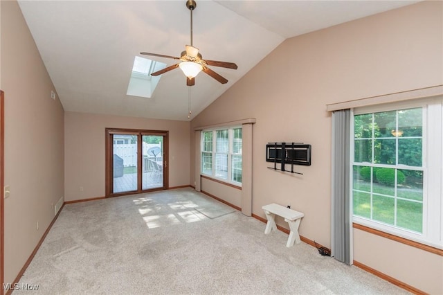 373 Chesapeake Cv, Painesville, OH 44077 - unfurnished room with ceiling fan, a skylight, light colored carpet, and high vaulted ceiling