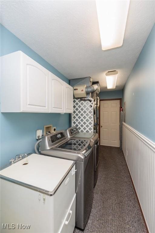 373 Chesapeake Cv, Painesville, OH 44077 - laundry room featuring cabinet space, independent washer and dryer, and dark colored carpet
