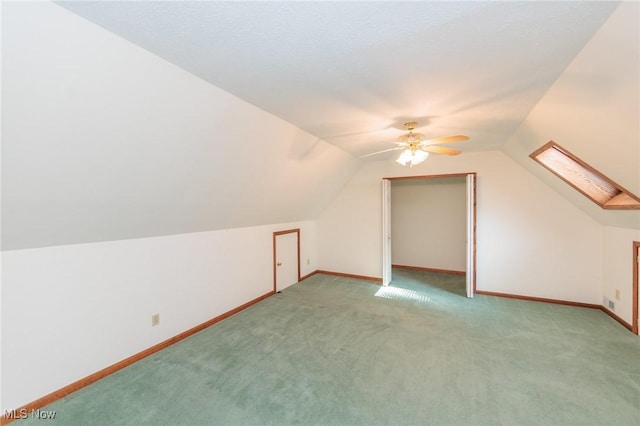 373 Chesapeake Cv, Painesville, OH 44077 - additional living space with light colored carpet, lofted ceiling, and ceiling fan