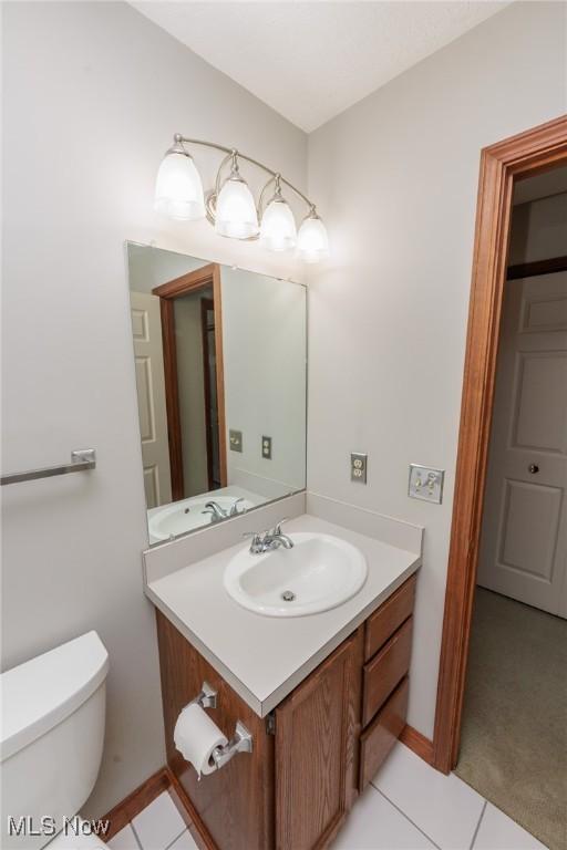 373 Chesapeake Cv, Painesville, OH 44077 - half bath with vanity and tile patterned floors