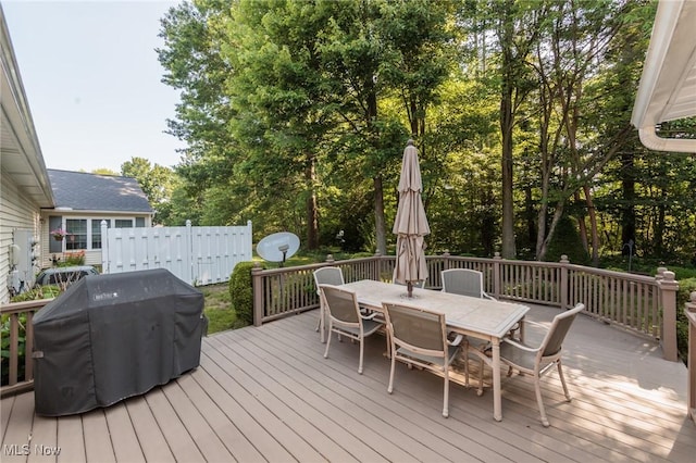 373 Chesapeake Cv, Painesville, OH 44077 - wooden deck with outdoor dining area and area for grilling