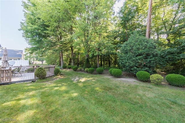 373 Chesapeake Cv, Painesville, OH 44077 - view of grassy yard featuring a deck and outdoor dining space