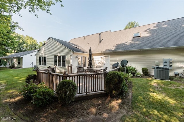 373 Chesapeake Cv, Painesville, OH 44077 - back of house with a lawn, a deck, and roof with shingles