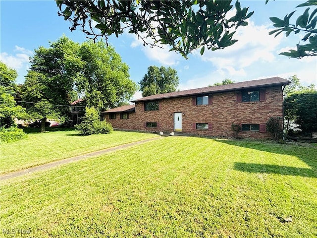 206 E 4th St, Williamstown, WV 26187 - back of property featuring a yard and brick siding