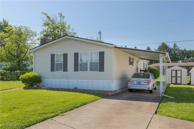 18592 Edwards Rd Unit 1, Doylestown, OH 44230 - manufactured / mobile home with a storage shed, concrete driveway, a front lawn, and a chimney