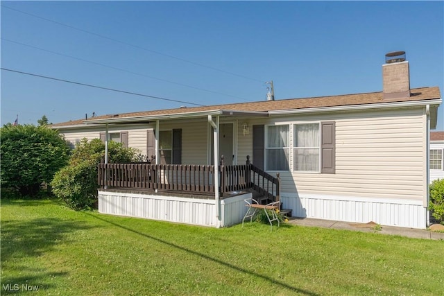 18592 Edwards Rd Unit 1, Doylestown, OH 44230 - manufactured / mobile home with a front yard, a chimney, and covered porch