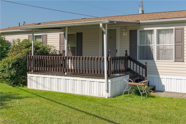 18592 Edwards Rd Unit 1, Doylestown, OH 44230 - view of front facade with a front yard, covered porch, and roof with shingles